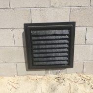 Louvered Vent in side of house.