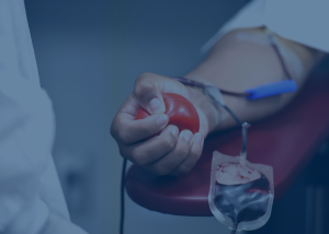 Arm with a needle taking blood out.