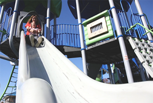 Mother and child at the top of a slide.