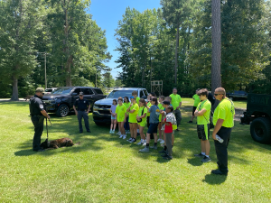 Group of campers wearing yellow, at the Youth Safety Camp.