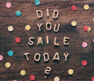 Did you smile today? printed on board with dots around it.