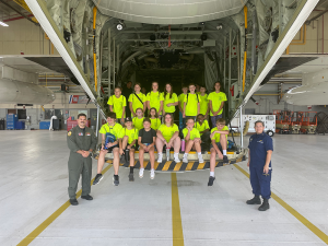 Summer Safety Camp participants in the back of a helicopter with two Coast Guard men.