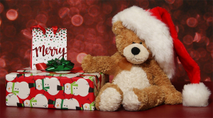 Christmas gifts with teddy bear with a Santa Hat.