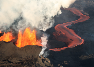 erupting volcano with lava flow and steam