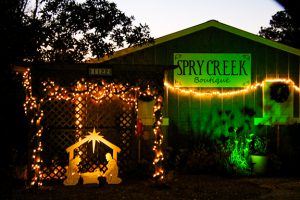 Christmas decoration of manager in front of Spry Creek Boutique