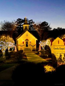 Corolla Chapel at dusk with Christmas lights.